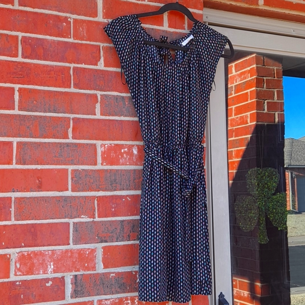 Lauren Conrad XS Black knee length dress with cute heart pattern.
